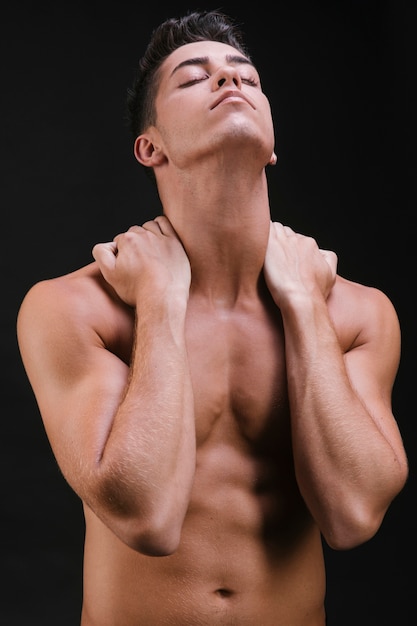 muscular-man-stretching-neck_23-2148252848